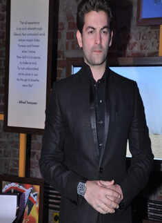 Neil launches coffee table book