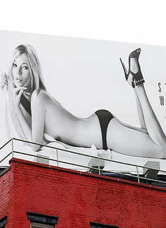 Kate Moss stops traffic with topless poster