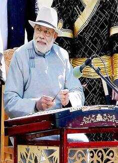 Narendra Modi playing a traditional Mongolian music instrument  Photogallery Times of India