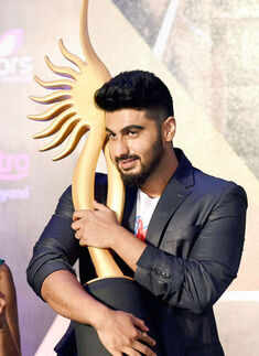 Arjun Kapoor poses with a trophy Photogallery - Times of India