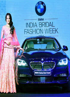 Sonakshi Sinha poses next to the newly launched BMW 6 Series Gran Coupe Photogallery - Times of India