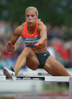 Nadine Broersen of the Netherlands competes in the 100 metres hurdles in the women's heptathlon Photogallery - Times of India