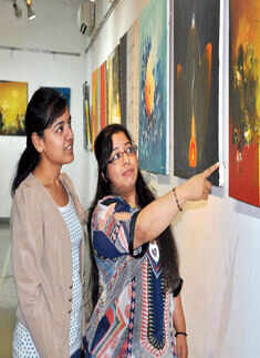 Guests at the art exhibition Photogallery Times of India