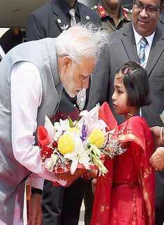 Prime Minister Narendra Modi being presented Photogallery - Times of India