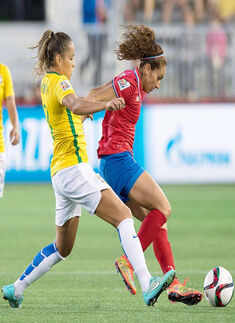 Brazil's Monica, left, battles Costa Rica's Carolina Venegas