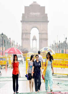 Youngsters enjoy as it rains after the Yoga Day event