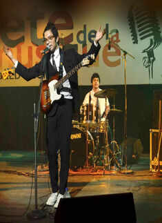 A band member performs during a musical night