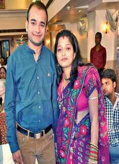 Arvind and Devika pose for a photo