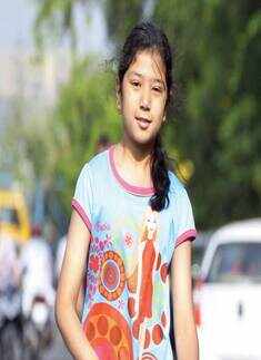 A youngster takes to her scooter during the Raahgir day in Bhopal