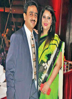 Raghvendra poses his wife Anupama during a farewell party