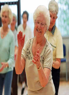 An elderly woman dances
