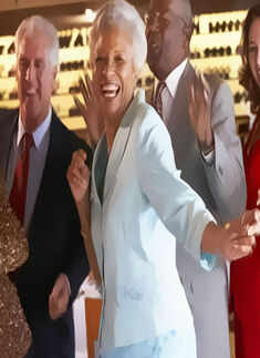 An elderly woman grooves