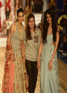 Designer Monisha Jaising with Pernia Qureshi and Kriti Sanon during her show