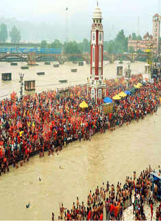 Devotees carrying kanwads wait to carry Ganga jal
