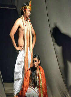 Artists perform a theatrical adaptation of Bollywood film