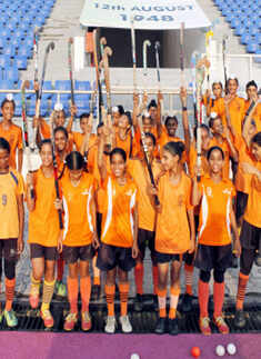 Students of Rani Jhansi Brigade Mehar Baba Trust, Bassi Pathana waves Hockey Sticks