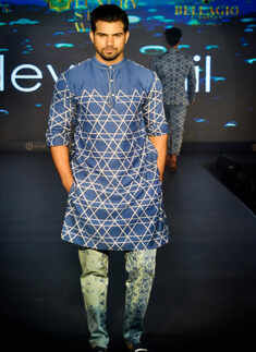 A model showcases a creation of Dev r Nil