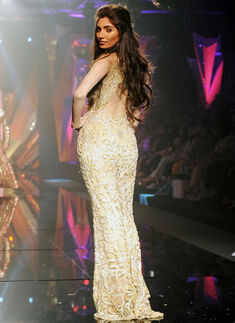 A model showcases a creation by designers Abu Jani and Sandeep Khosla