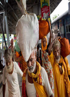 Hindu pilgrims arrive at a train station in Nasik