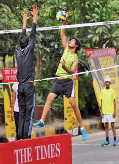 Participants play volleyball during Raahgiri Day