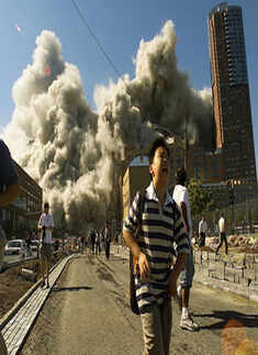 People run away as the North Tower