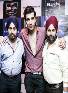 ​Designer duo Ravinder and Tejinder Singh pose with a friend