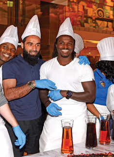 Chennaiyin FC players attend cake-mixing event