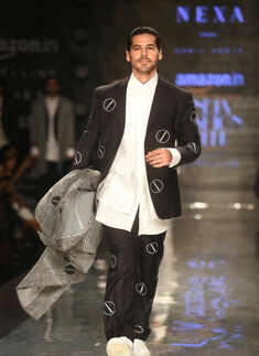 Dino Morea walks the ramp for designer Sahil Aneja