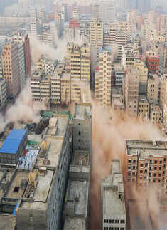 Smokes rising as buildings crumble