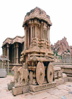 Visit ancient temples in Hampi