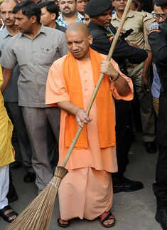Yogi Aditynath wields broom for cleaner UP