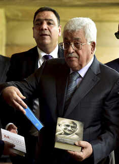 Mahmoud Abbas is presented books