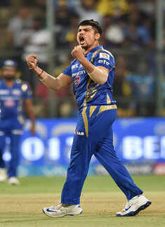 Karn Sharma celebrates the wicket of Sunil Narine
