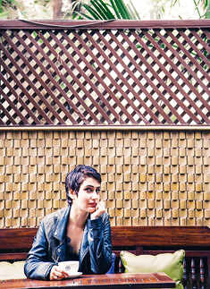 Fatima posing with a coffee mug