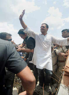 ​Rahul Gandhi waves to his supporters at Naya Gaon