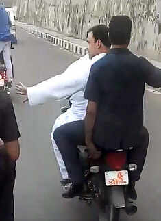 ​Rahul Gandhi rides pillion on a bike