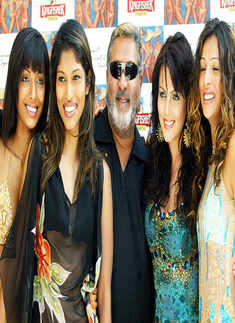 Vijay Mally poses with models