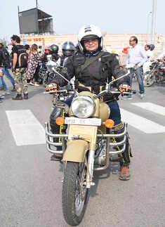 A lady biker poses during a bike rally
