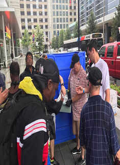 Volunteers from Indian community serve food