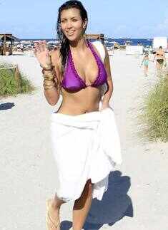 Kim Kardashian in purple bikini