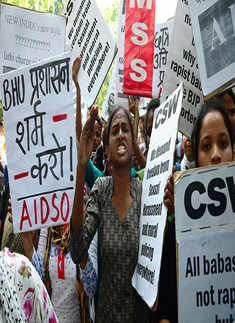 Students hold placards