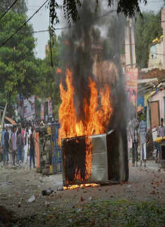 ​ Vehicles set on fire after a clash between two communities