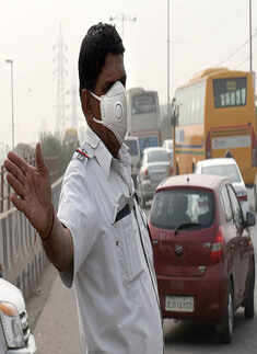 A traffic policeman wears mask