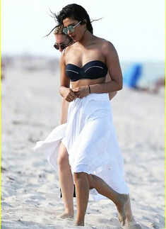 Priyanka walking on the beach