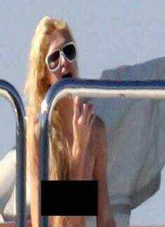 Paris Hilton goes topless on a trip