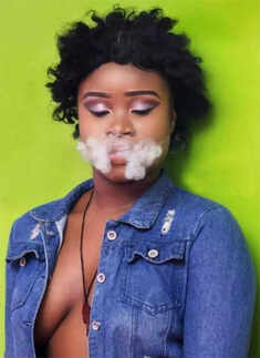 Smoking and posing semi naked, beauty queen dethroned