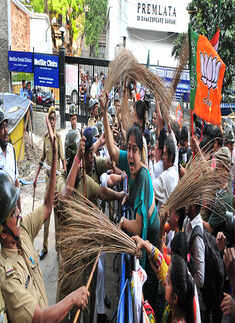 BJP members beat up police with broom