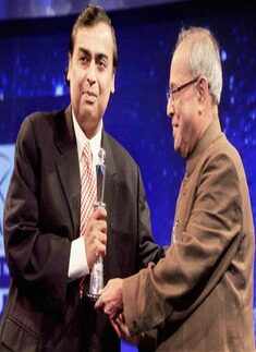 Union Finance Minister Pranab Mukherjee presents the Business Leader of the year award to Reliance Industries' CMD Mukesh Ambani