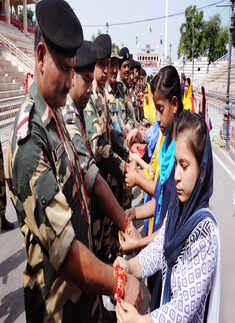 Women tie rakhis to jawans, police personnel