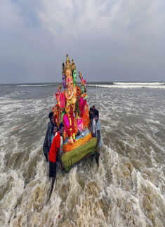 Devotees immerse idols of Lord Ganesha 